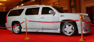 Illustration for article titled Christian Audigier Creates Snorkel-Nosed Custom Cadillac Escalade